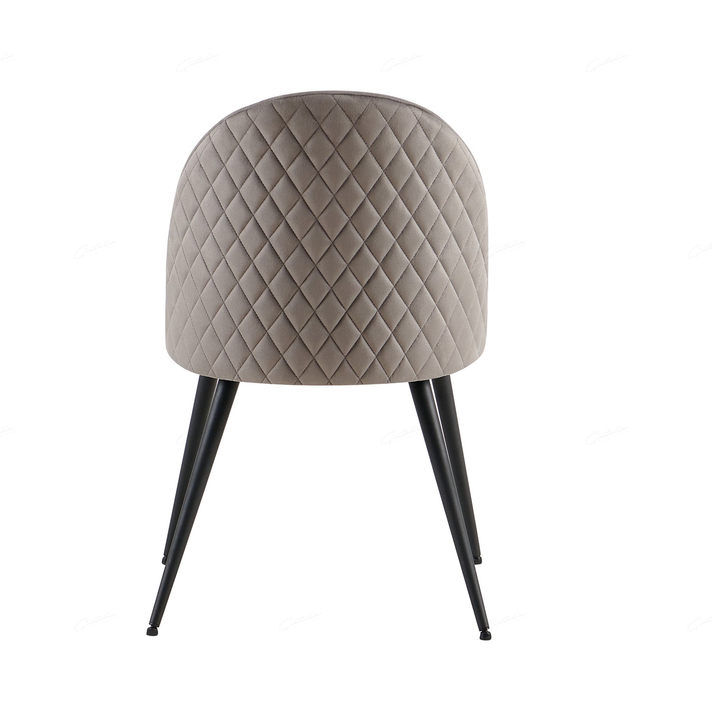 Wrapped in luxurious grey velvet, the Zita Dining Chair offers not only superior comfort but also a sophisticated aesthetic. Its plush, upholstered seat and back provide the perfect balance of support and style, making it an ideal choice for any modern dining room.