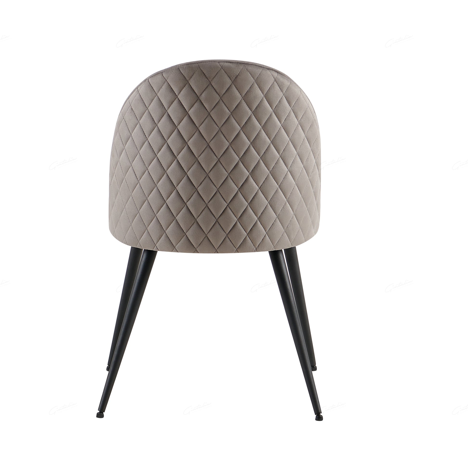 Wrapped in luxurious grey velvet, the Zita Dining Chair offers not only superior comfort but also a sophisticated aesthetic. Its plush, upholstered seat and back provide the perfect balance of support and style, making it an ideal choice for any modern dining room.